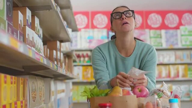 Woman checks an expensive shopping receipt and faints