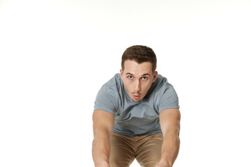 happy guy looking pointing at the camera on white studio background