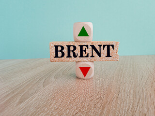 Brent symbol. A wooden cubes with up arrow. Brick block with the concept word BRENT . Beautiful...