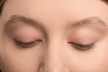 Woman with beautiful natural eyelashes, closeup view