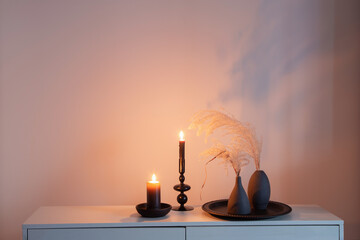 home decor with dried flowers and burning candles
