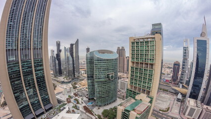 Obraz premium Panorama of Dubai international financial center skyscrapers aerial night to day timelapse.