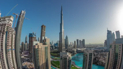 Foto op Plexiglas Panorama of Dubai Downtown cityscape with tallest skyscrapers around aerial night to day timelapse. © neiezhmakov