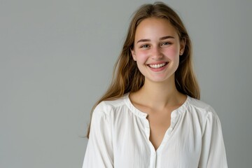 Fototapeta premium Portrait of a Smiling Young Woman in White Shirt . Generative AI.