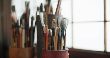 Paint brush, equipment and supplies in empty workshop closeup for art, creative or talent showcase. Studio interior or room with still life objects for artistic creativity or artwork drawing