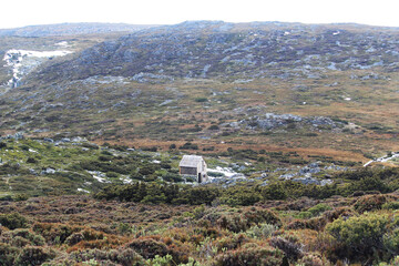 Fototapeta premium A small hut in rugged rocky landscape