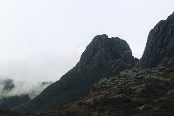 Rocky mountains with fog in the hills