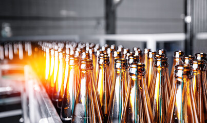 Beer bottles on conveyor production line. Banner Brewery industry food factory manufacturing