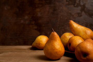 Pears on wooden background as background image..