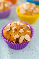 Lemon poppy seed muffins garnished with almond slivers