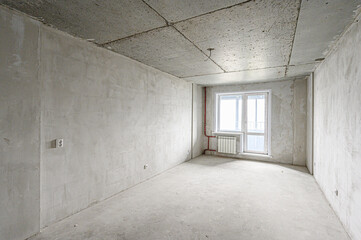 rough repairs for self-finishing. interior decoration, bare walls of the room, stage of construction. interior apartment room