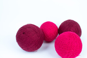 Knitting yarn for knitting on white background. red.