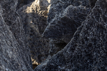 Rocks or stone arranged together with sunlight for background.