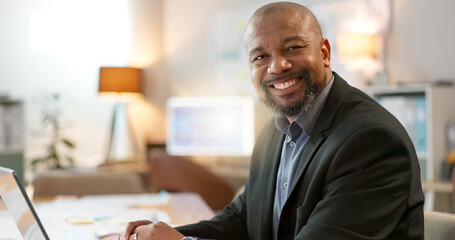 Portrait of happy black man in office, laptop and planning online research for creative project at...