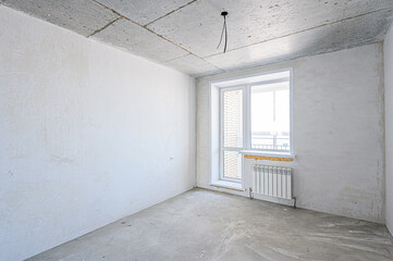 rough repairs for self-finishing. interior decoration, bare walls of the room, stage of construction. interior apartment room