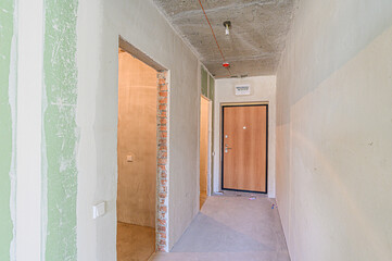rough repairs for self-finishing. interior decoration, bare walls of the room, stage of construction. interior apartment room
