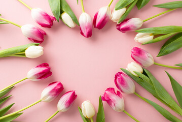 Express affection on Mother's Day with a charming top view scene of tulips forming a heart on a...
