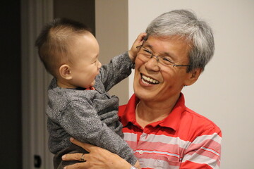 Grandpa and grandson enjoying a warm and intimate bonding moment
