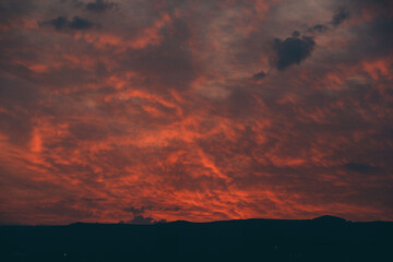 Purple orange sunset sky, red orange clouds. Beautiful evening clouds background