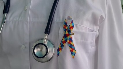 World Autism Awareness and Pride Day with ribbon with puzzle pattern. Autism causes symptoms of disease - Powered by Adobe