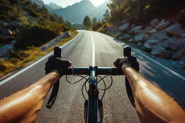 Rolgordijnen Photo of a cyclist in sporty attire, close-up on hands gripping handlebars, scenic mountain road in the  © Daunhijauxx