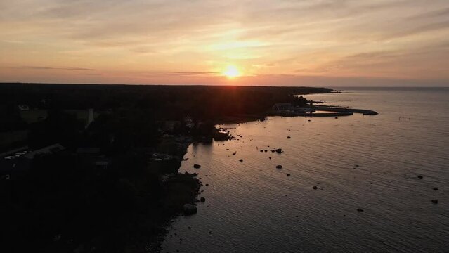 sunset over the sea with rocks and beatiful sky