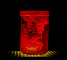 Cthulhu mythos god in a jar with red and yellow lighitng black background