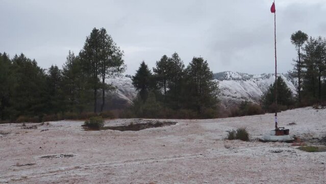 Tehri Garhwal : First snowfall blankets Himalayan meadows in Garhwal, Uttarakhand, India.