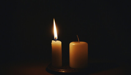 Radiant candle shines in the darkness, representing spiritual and festive essence.