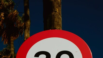 Maximum Speed 30 road sign, regulatory notice against a deep blue background