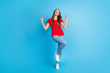Fototapeta na wymiar Full length photo of cheerful positive girl dressed trendy red clothes screaming yeah isolated on blue color background