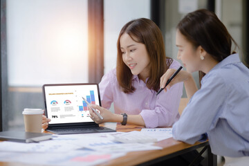 Technology and financial advisory services concept. Business teamwork and working on digital laptop computer with advisor showing plan of investment to clients at table office. Digital marketing.