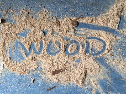 word wood spelled out in sawdust