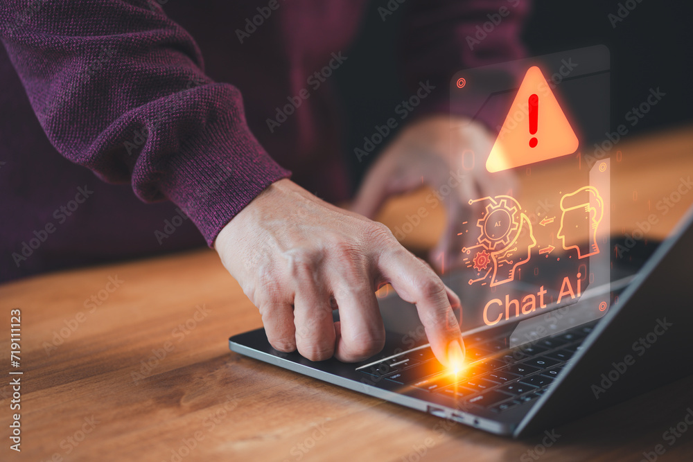 Poster Man using a laptop chatting with smart AI, apps artificial intelligence chatbot with triangle caution warning sign for notification error. Chat with application AI, Artificial Intelligence.