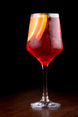 red cocktail glass with orange campari aperol spritz