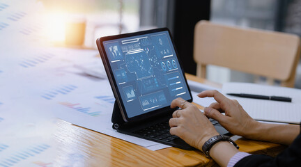 Business hands working on digital tablet with business infographic data concept, Analytics data...