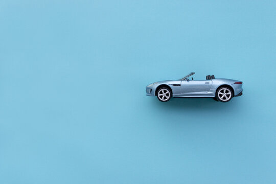Blue toy car isolated on blue background. After some edits.