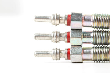 Modern ceramic glow plugs for warming up a diesel engine before starting. White background, isolate. Macro