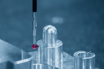 The  CMM probe measuring the  aluminum automotive parts.