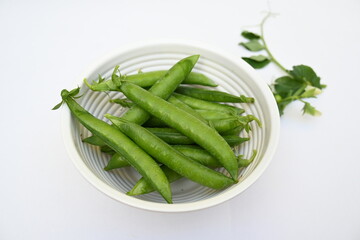 Fresh green pea isolated on white background. There is a lot of vitamins  and Minerals in it. The pea is most commonly the small spherical seed or the seed. Popular vegetable of all over world. 