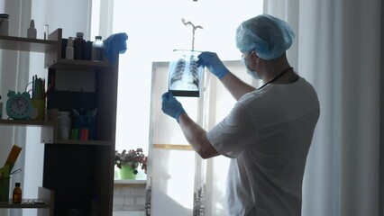 Doctor in the clinic with an x-ray in his hands. Diagnosis of the patient. Pneumonia disease, human pneumonia.
