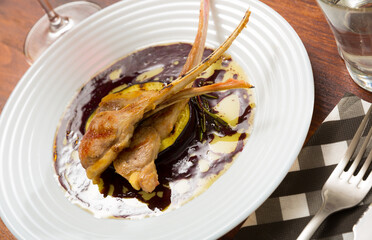 Delicious baked lamb ribs with grilled eggplant in wine sauce