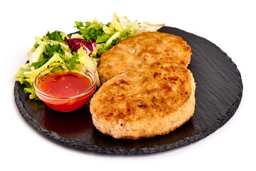 Fried pork schnitzels in breadcrumbs, isolated on white background.