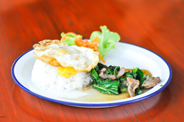 stir fried kale with pork and rice, sunny side up egg