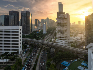 Fototapeta na wymiar Panoramic view of jakarta City, Indonesia, with beautiful sunset. Jakarta is the largest city in indonesia that also the center of governance and business district. 