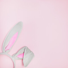 Rabbit ears headband for Easter on a pink background
