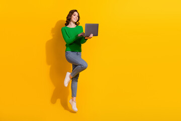 Full length photo of funny workaholic woman jumping high has much tasks using netbook internet...