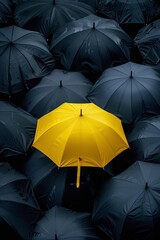 a yellow half transparent umbrella in the middle of a flock of black half transparent umbrellas