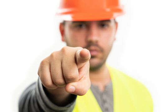 Selective focus close-up of builder pointing index finger