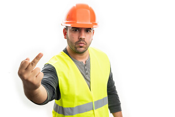 Angry builder man showing offensive middle finger gesture